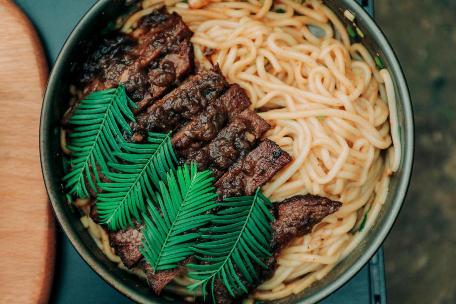 Corporate team collaborating during professional cooking workshop